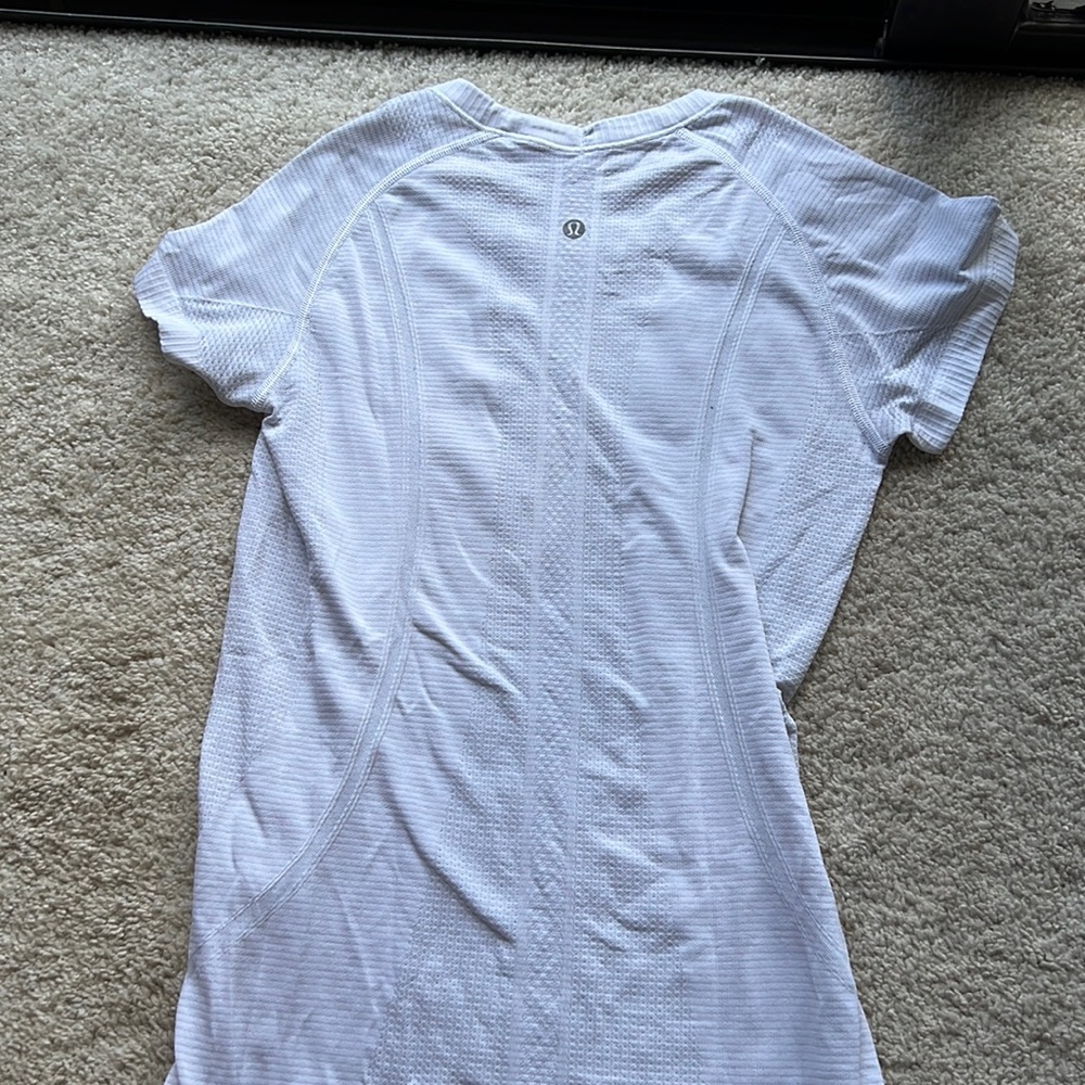 White Lululemon Swiftly Tech workout shirt
